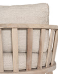 Nikki Beach Occasional Chair with natural timber frame and neutral upholstered cushions, showcasing a modern coastal design