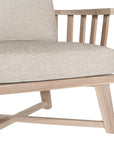 Nikki Beach Occasional Chair with natural timber frame and neutral upholstered cushions, showcasing a modern coastal design