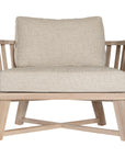 Nikki Beach Occasional Chair with natural timber frame and neutral upholstered cushions, showcasing a modern coastal design