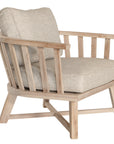 Nikki Beach Occasional Chair with natural timber frame and neutral upholstered cushions, showcasing a modern coastal design