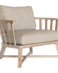 Nikki Beach Occasional Chair with natural timber frame and neutral upholstered cushions, showcasing a modern coastal design