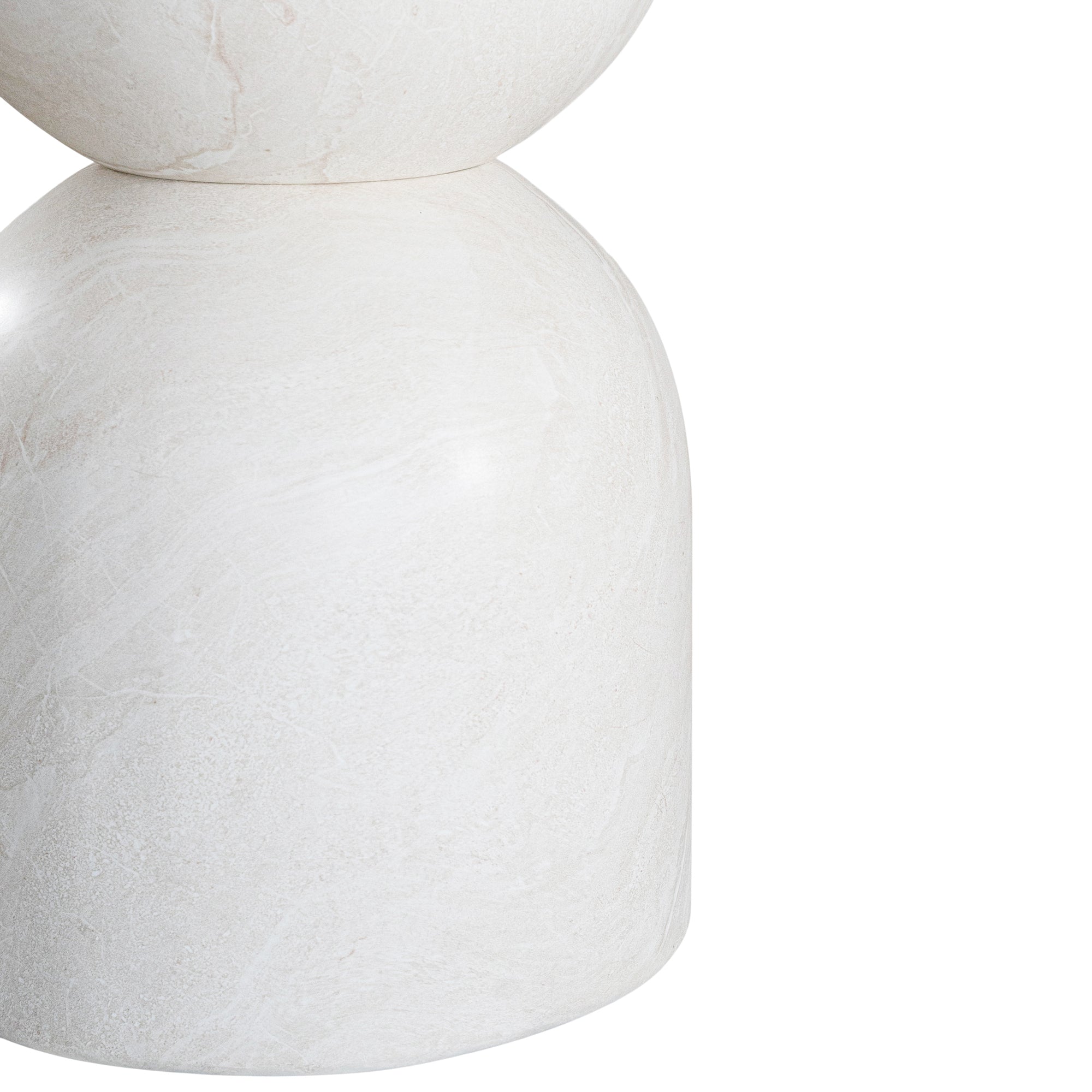 Nuru dining table in eggshell finish with round stone top and sculptural pedestal base isolated on a light background