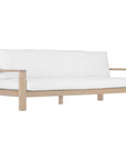 The Kulala Living Outdoor Teak Armchair features a solid teak frame with a natural finish and plush white cushions. Designed for both comfort and durability, this elegant armchair brings a relaxed, resort-style aesthetic to any outdoor living space