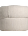 A contemporary pebble upholstered lounge chair with a low-profile design and curved backrest. This modern, armless seating piece features a smooth, rounded silhouette, making it a stylish and comfortable addition to any living space