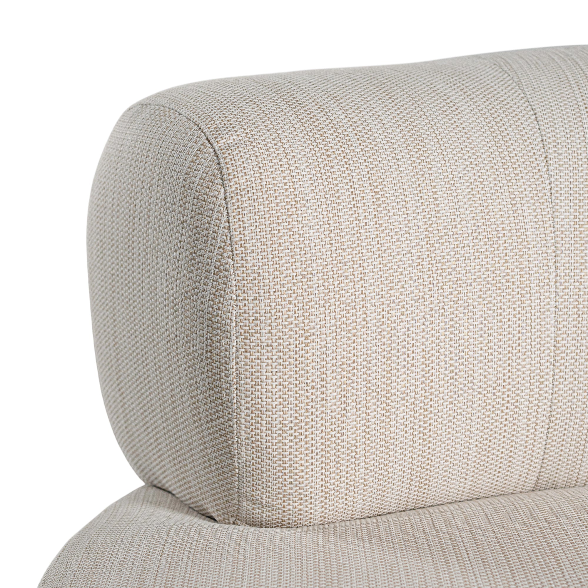 A contemporary pebble upholstered lounge chair with a low-profile design and curved backrest. This modern, armless seating piece features a smooth, rounded silhouette, making it a stylish and comfortable addition to any living space