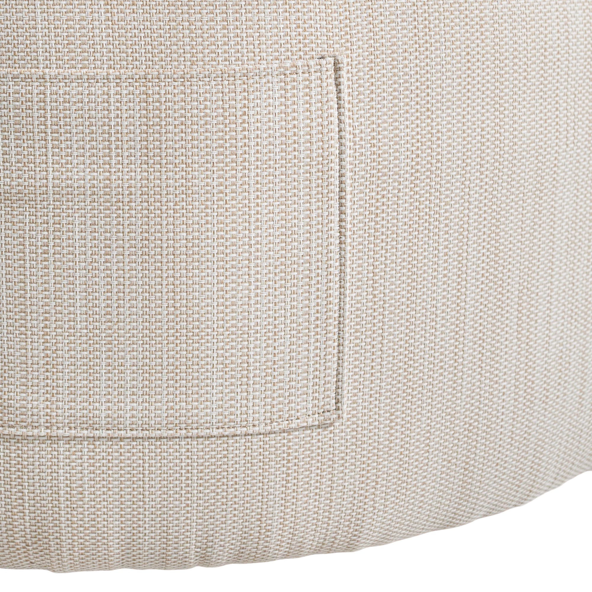 A contemporary pebble upholstered lounge chair with a low-profile design and curved backrest. This modern, armless seating piece features a smooth, rounded silhouette, making it a stylish and comfortable addition to any living space