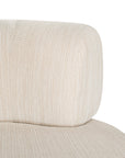 A contemporary pebble upholstered lounge chair with a low-profile design and curved backrest. This modern, armless seating piece features a smooth, rounded silhouette, making it a stylish and comfortable addition to any living space