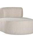 A contemporary pebble upholstered lounge chair with a low-profile design and curved backrest. This modern, armless seating piece features a smooth, rounded silhouette, making it a stylish and comfortable addition to any living space