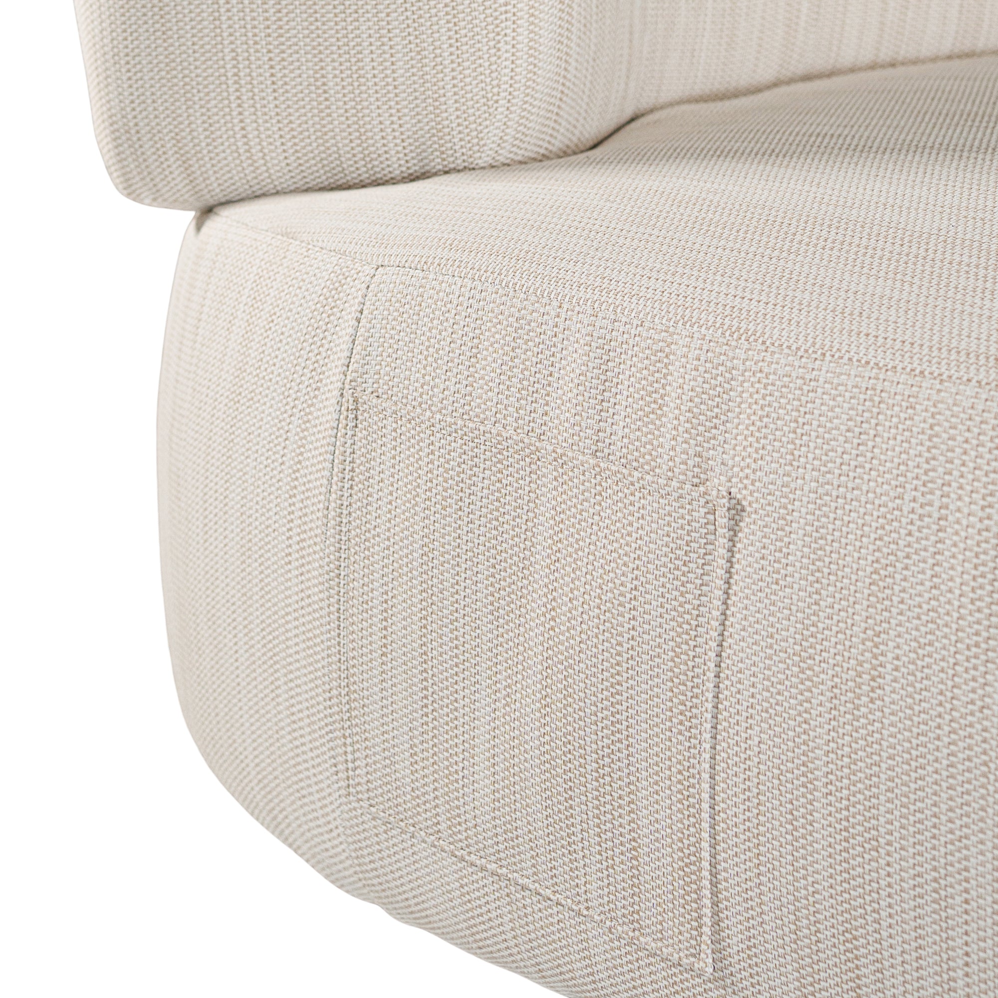 A contemporary pebble upholstered lounge chair with a low-profile design and curved backrest. This modern, armless seating piece features a smooth, rounded silhouette, making it a stylish and comfortable addition to any living space