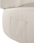 A contemporary pebble upholstered lounge chair with a low-profile design and curved backrest. This modern, armless seating piece features a smooth, rounded silhouette, making it a stylish and comfortable addition to any living space