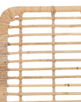 A handwoven rattan dining chair with a white metal frame, featuring an airy, open-weave design. The natural rattan seat and backrest bring an organic touch to contemporary and coastal interiors