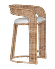 A natural rattan bar stool with a curved backrest and a white upholstered cushion. The woven texture and sturdy frame bring a relaxed yet sophisticated coastal-inspired aesthetic to any bar or kitchen counter