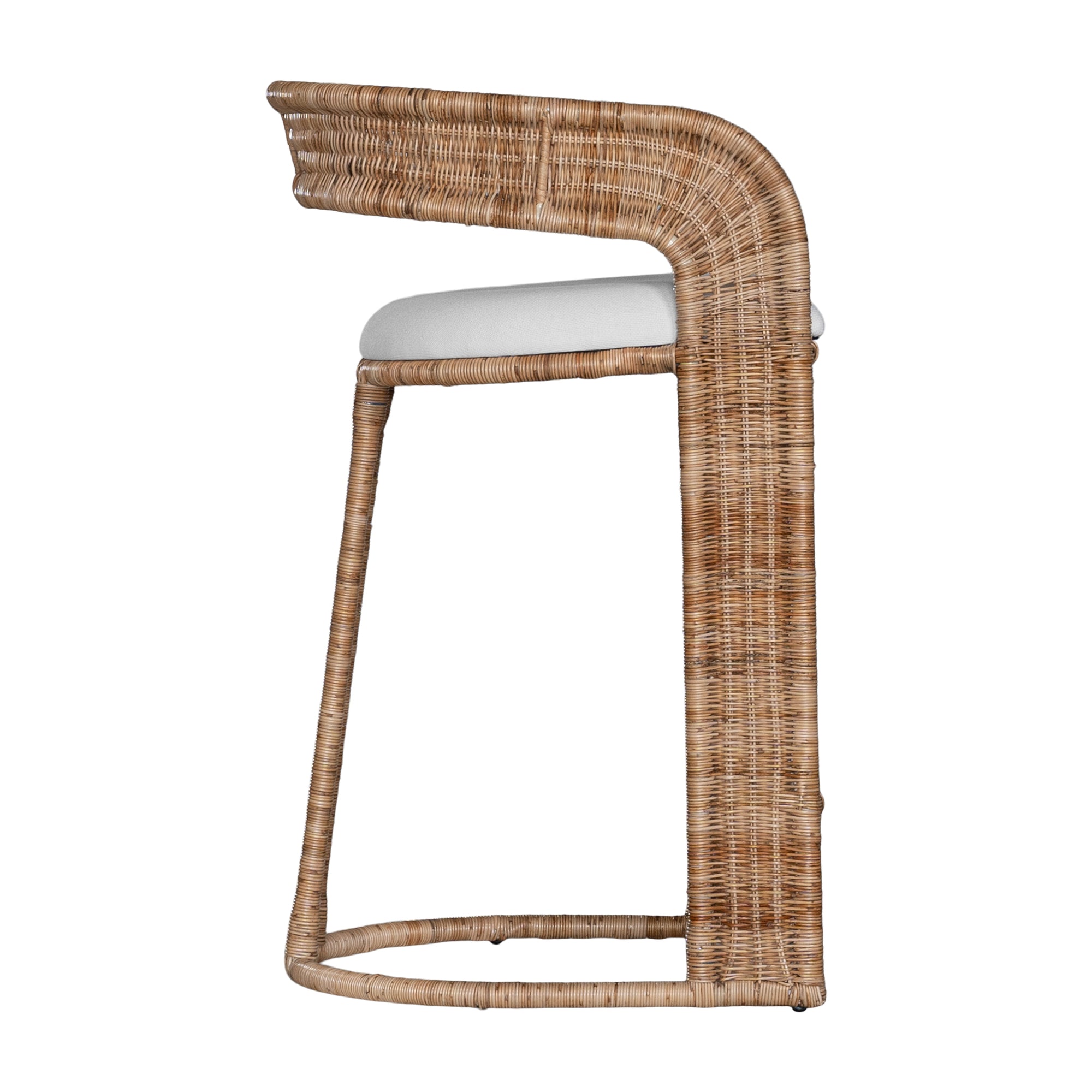 A natural rattan bar stool with a curved backrest and a white upholstered cushion. The woven texture and sturdy frame bring a relaxed yet sophisticated coastal-inspired aesthetic to any bar or kitchen counter