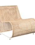 Modern coastal rattan lounge chair with curved silhouette and open weave pattern, featuring a natural finish and sleek white metal frame