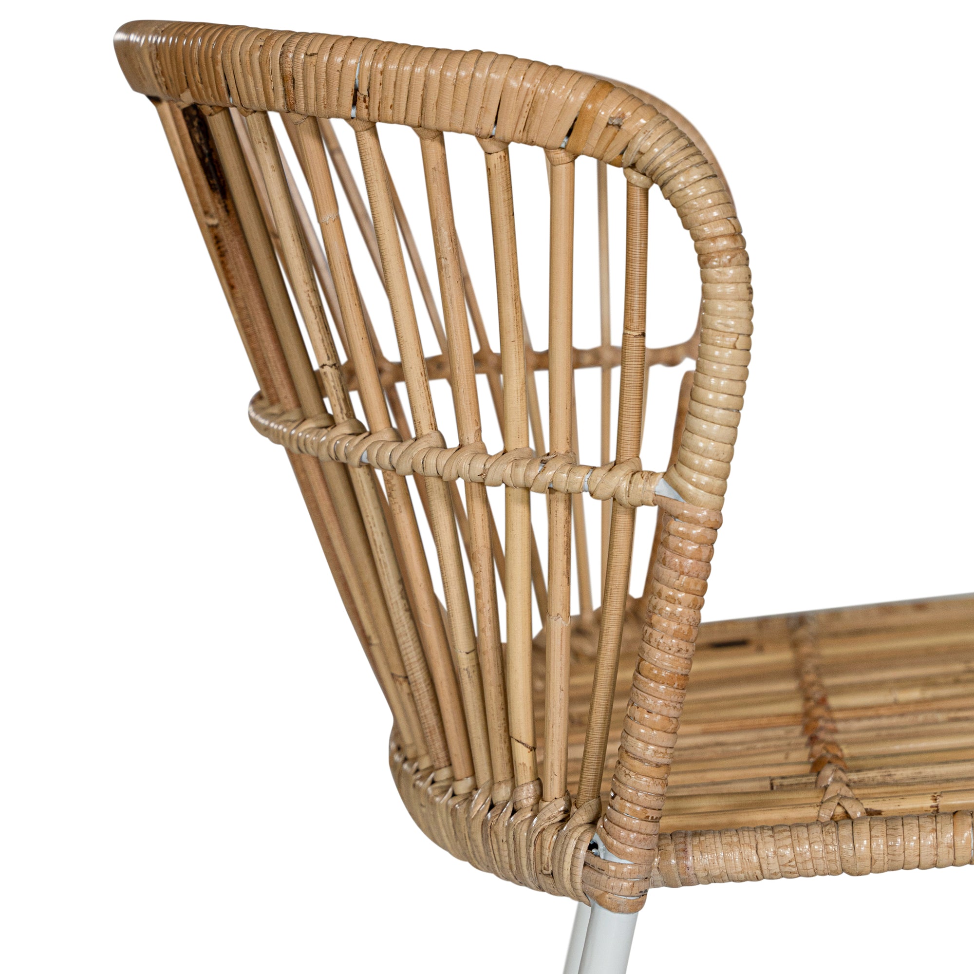Modern rattan dining chair with a white metal frame, featuring a curved backrest and woven natural rattan for a stylish and airy aesthetic
