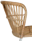 Modern rattan dining chair with a white metal frame, featuring a curved backrest and woven natural rattan for a stylish and airy aesthetic