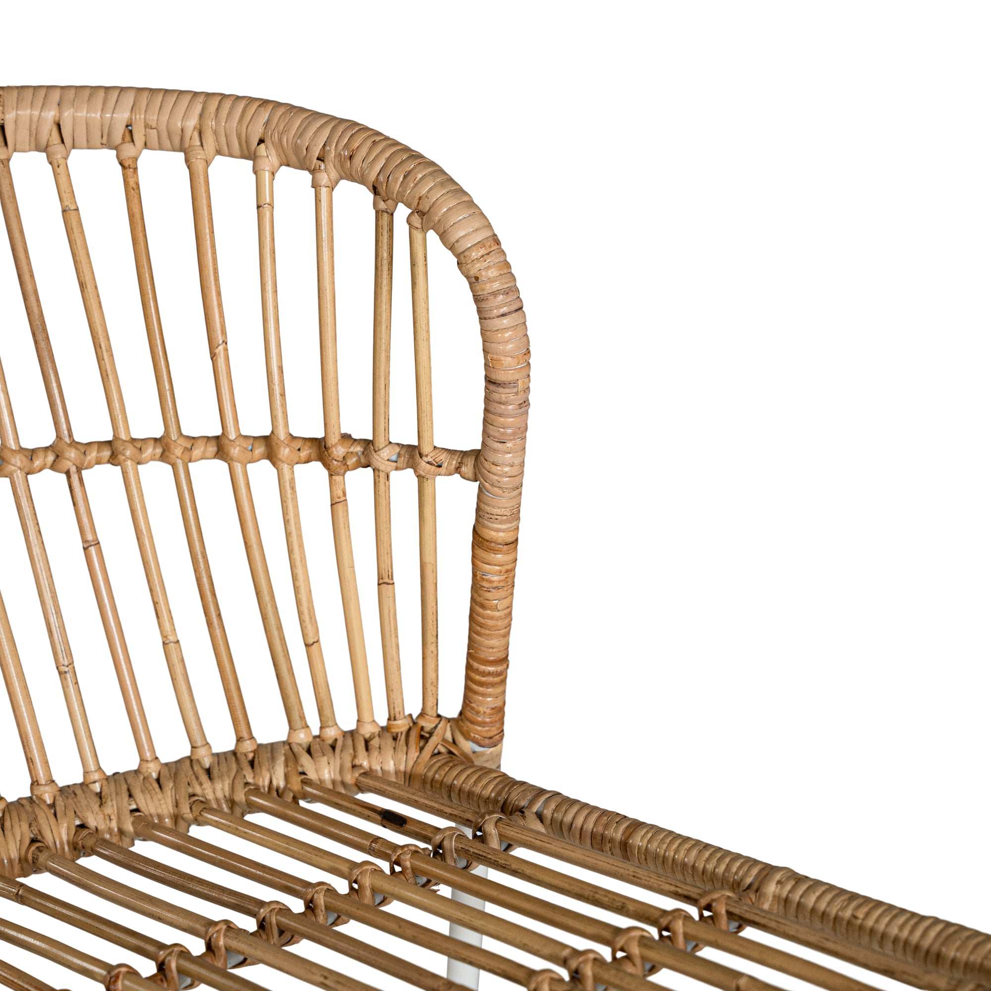 Modern rattan dining chair with a white metal frame, featuring a curved backrest and woven natural rattan for a stylish and airy aesthetic