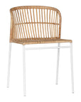 Modern rattan dining chair with a white metal frame, featuring a curved backrest and woven natural rattan for a stylish and airy aesthetic