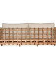 Handcrafted rattan two seater sofa featuring an intricate open-weave frame with plush natural cushions, combining natural texture with contemporary comfort for indoor or covered outdoor spaces