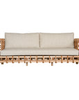 Handcrafted rattan two seater sofa featuring an intricate open-weave frame with plush natural cushions, combining natural texture with contemporary comfort for indoor or covered outdoor spaces