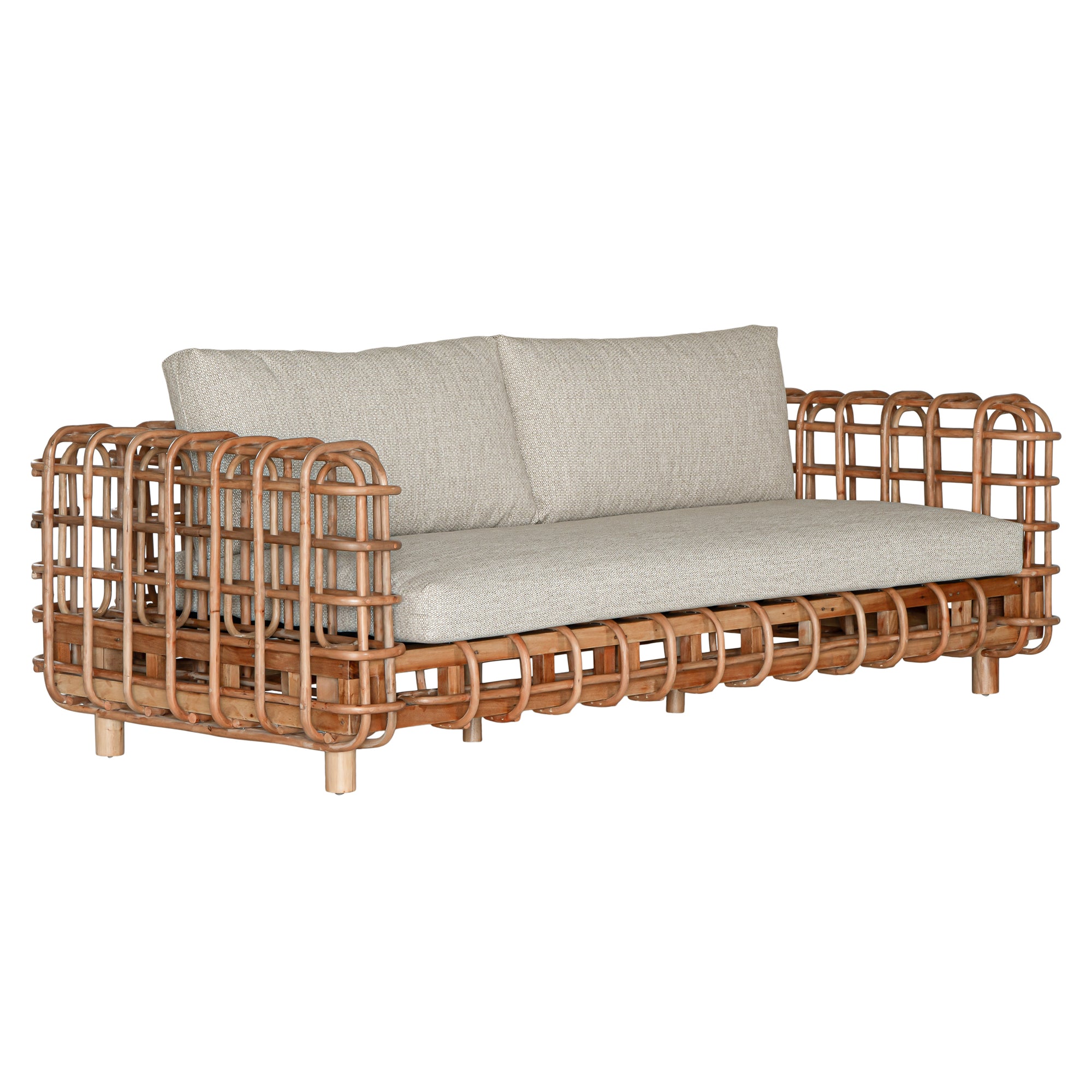Handcrafted rattan two seater sofa featuring an intricate open-weave frame with plush natural cushions, combining natural texture with contemporary comfort for indoor or covered outdoor spaces