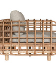 Handcrafted rattan two seater sofa featuring an intricate open-weave frame with plush natural cushions, combining natural texture with contemporary comfort for indoor or covered outdoor spaces