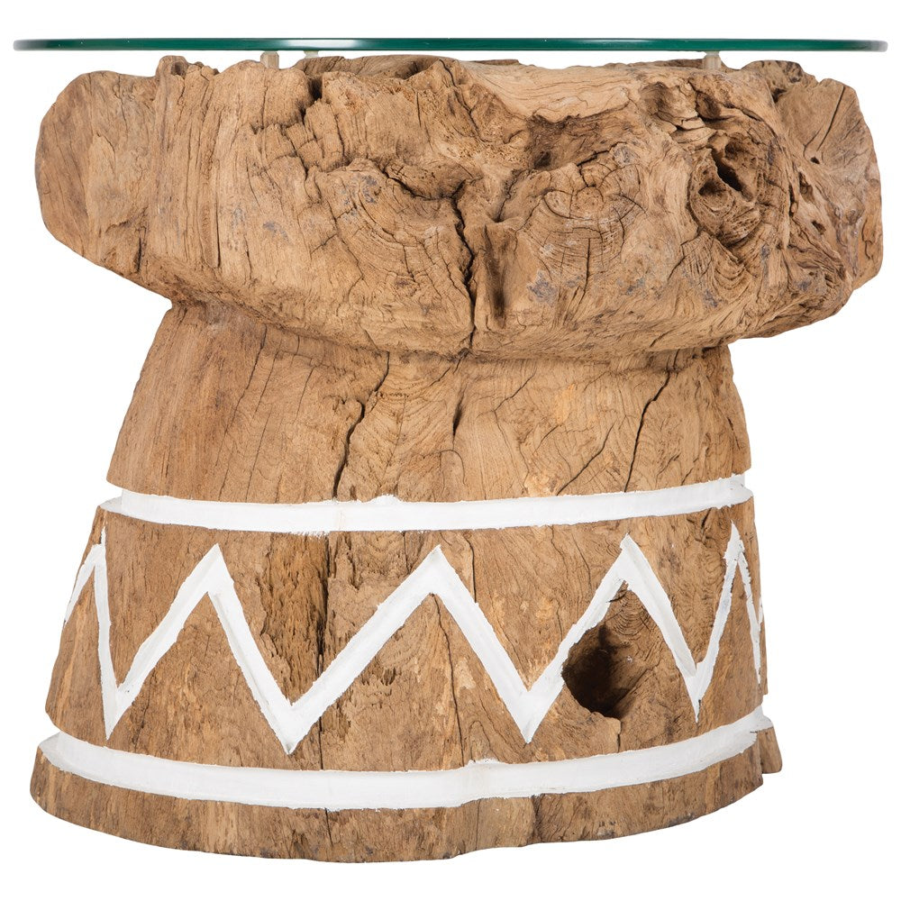 A handcrafted side table made from reclaimed teak with a raw, organic texture and white tribal-inspired detailing. Topped with a round glass surface, this unique piece combines rustic charm with contemporary functionality, perfect for coastal, bohemian, or eclectic interiors
