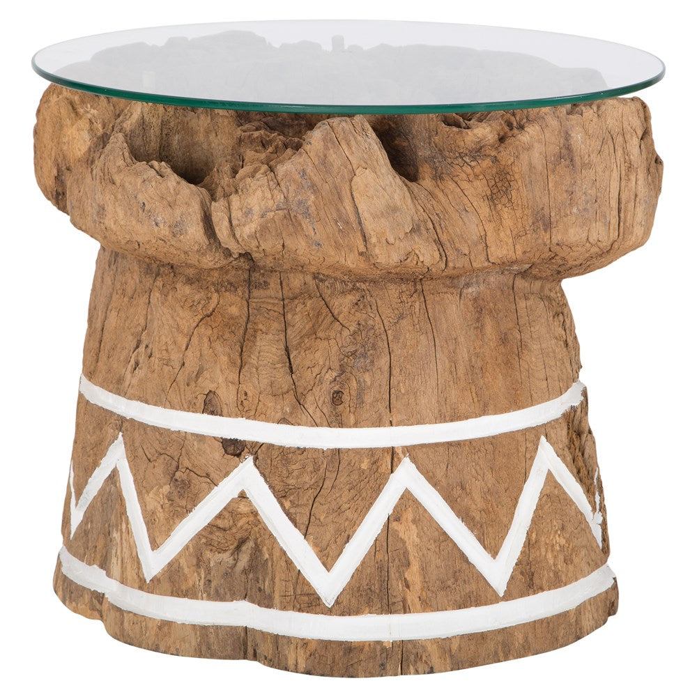 A handcrafted side table made from reclaimed teak with a raw, organic texture and white tribal-inspired detailing. Topped with a round glass surface, this unique piece combines rustic charm with contemporary functionality, perfect for coastal, bohemian, or eclectic interiors