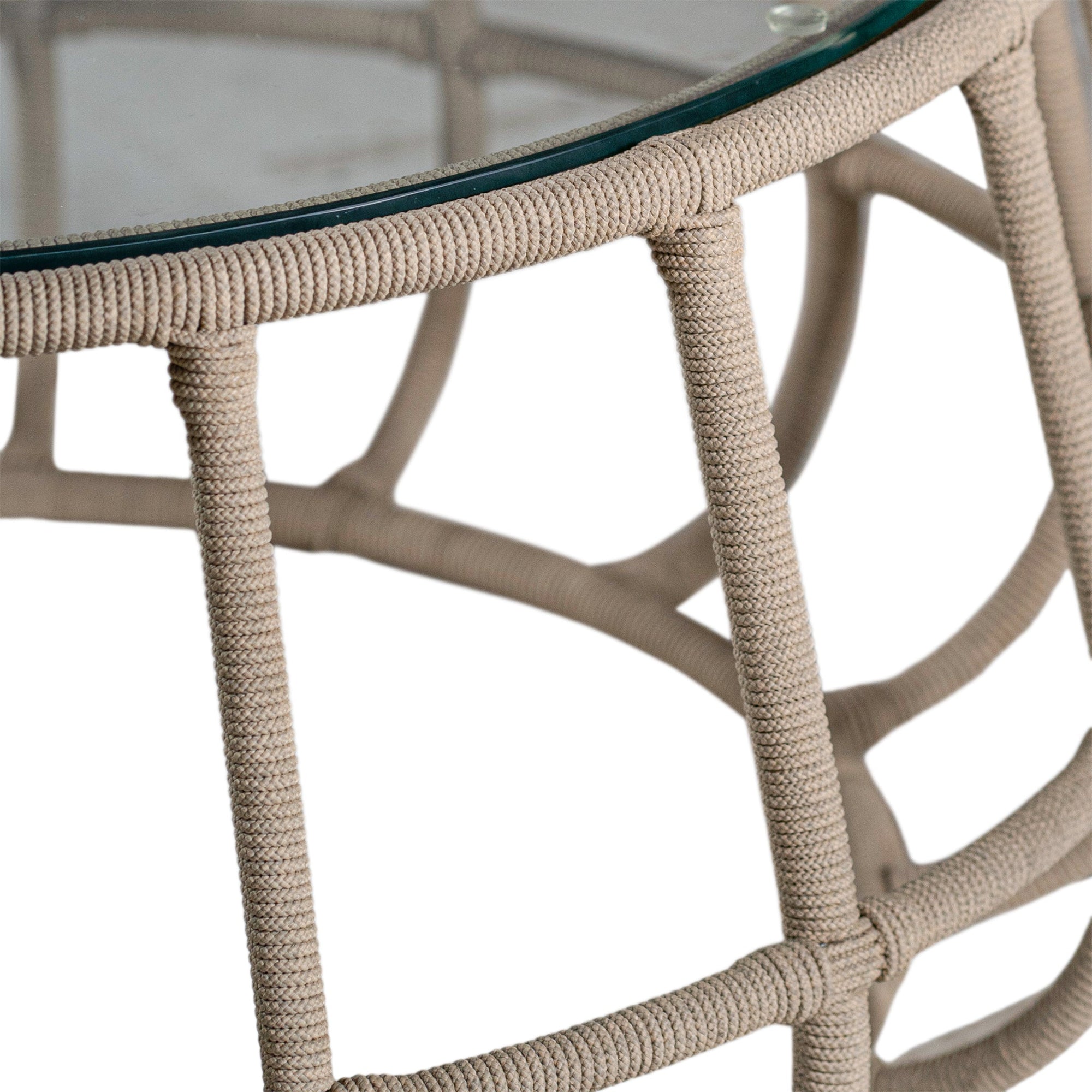 Contemporary aluminium rope weave coffee table with a glass top, featuring an open, airy design in a neutral tone, perfect for modern coastal or bohemian-inspired interiors