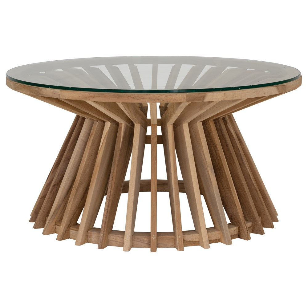 A stylish round dining table featuring a sculptural wooden base with a clear glass top, offering a contemporary yet natural aesthetic for modern dining spaces.