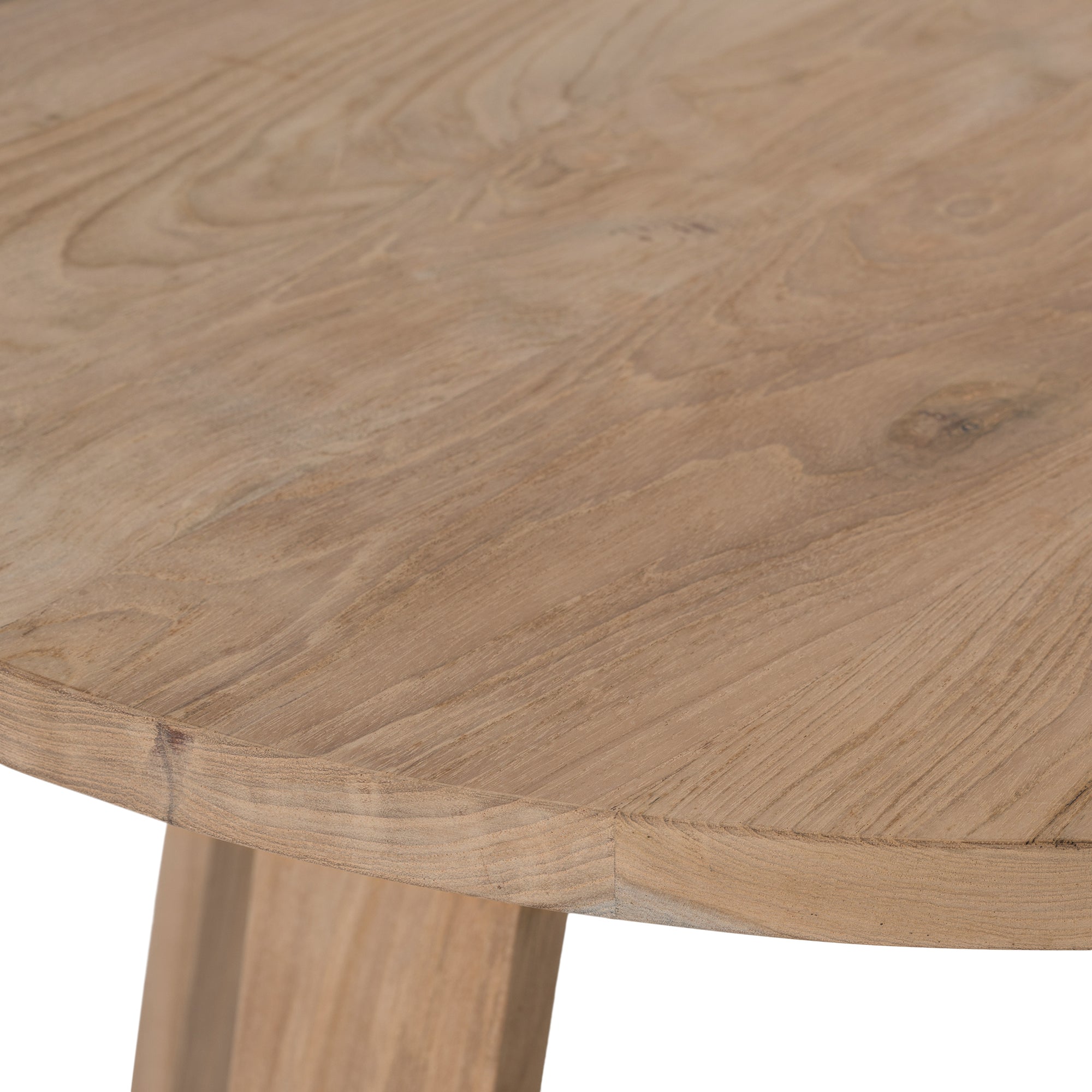 Round teak cafe table with a natural finish and angled legs, perfect for relaxed modern interiors