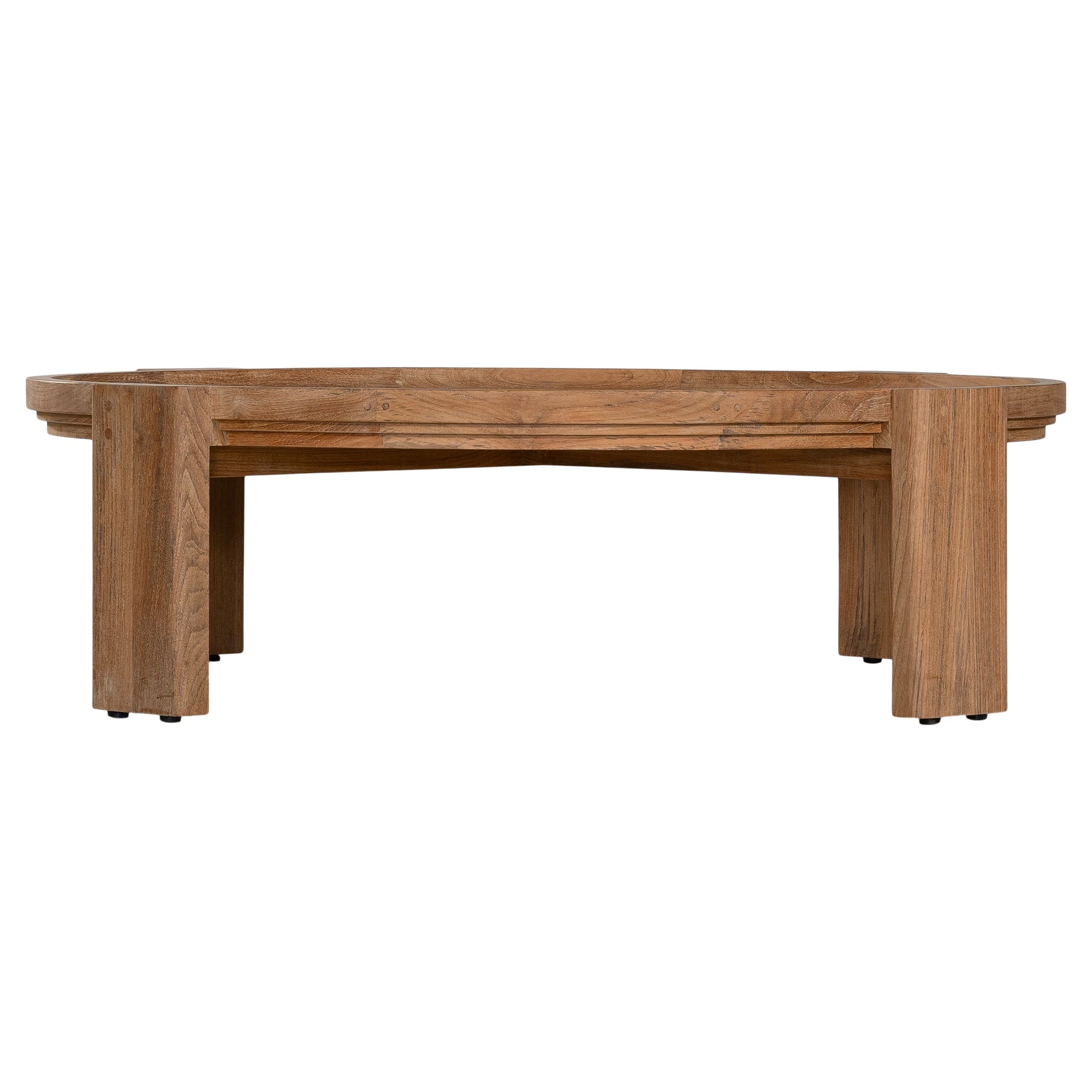 The Kulala Living Round Teak Coffee Table, crafted from solid teak with a slatted tabletop and sturdy block legs. This timeless design adds warmth and natural texture to any living space.