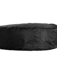 Curved upholstered ottoman with natural textured fabric and subtle black feet, ideal for contemporary living spaces
