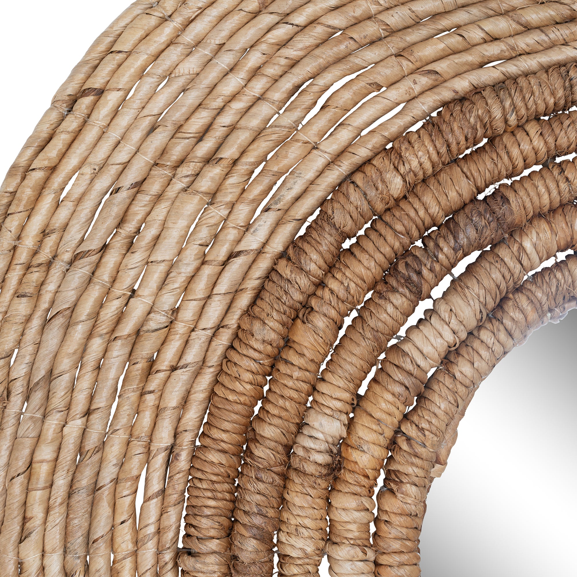 Round woven wall mirror with natural fibre frame, ideal for adding a coastal and rustic touch to interior spaces