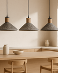 Trio of Sable Pendant lights in Fossil finish by KULALA Living, styled above a natural timber kitchen island in a minimalist interior.