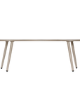 Solara coffee table with organic curved shape and light finish on a clean studio background.