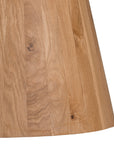 A beautifully crafted round dining table made from solid oak, featuring a minimalist conical base for a timeless and contemporary design