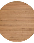 A beautifully crafted round dining table made from solid oak, featuring a minimalist conical base for a timeless and contemporary design