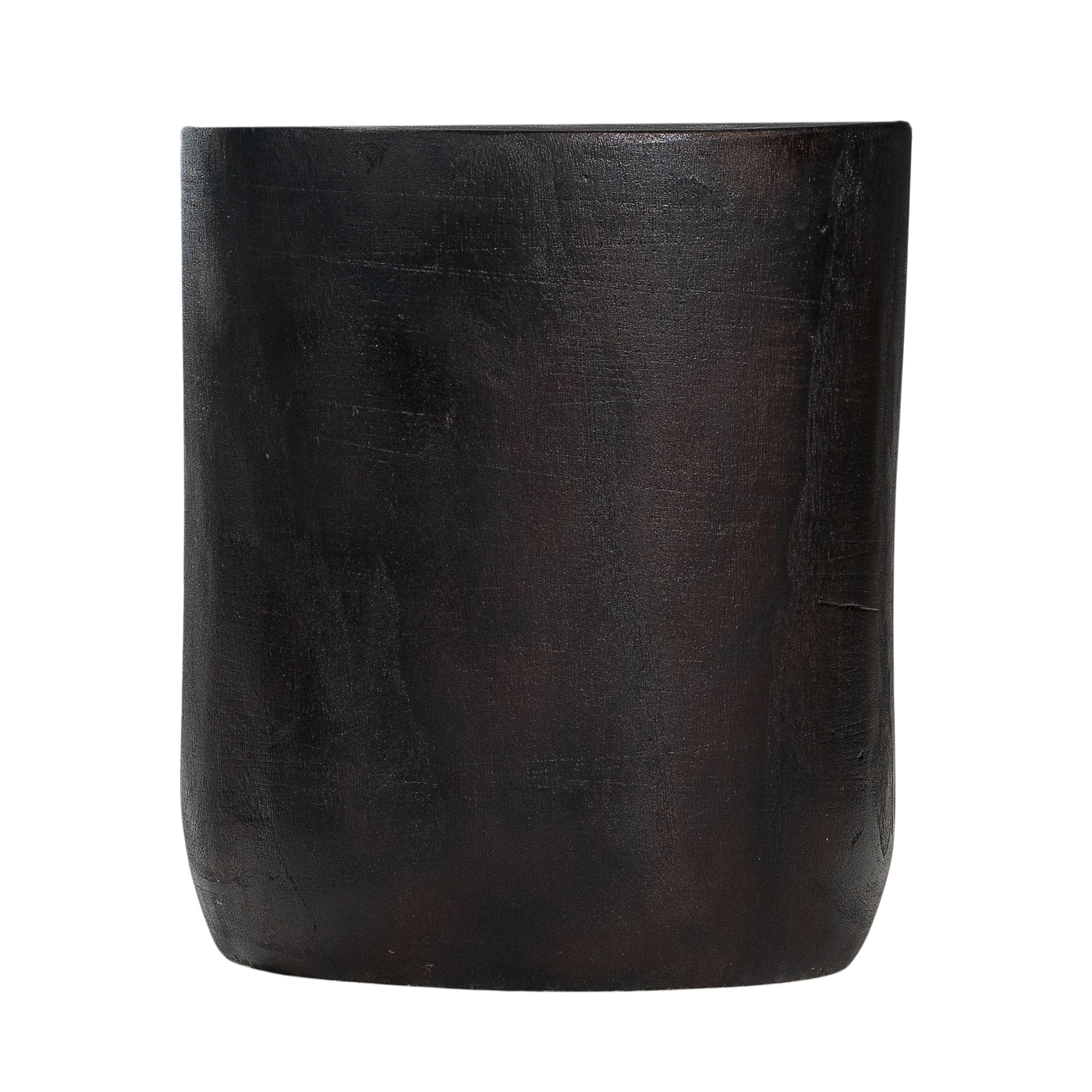 A solid timber stool with a smooth black finish, featuring a minimalist cylindrical design. Ideal as a side table or additional seating for modern and organic interiors