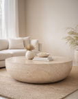 Tabati coffee table in dune hydro dipped finish with rounded low profile form styled in a soft neutral living space.