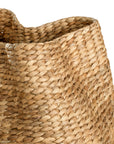 Talura basket set in natural handwoven seagrass with organic rounded shape and softly structured open tops.
