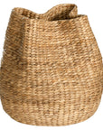 Talura basket set in natural handwoven seagrass with organic rounded shape and softly structured open tops.
