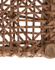 Natural teak and leather bench with a woven seat and solid wooden frame, showcasing artisanal craftsmanship and organic textures