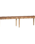Natural teak and leather bench with a woven seat and solid wooden frame, showcasing artisanal craftsmanship and organic textures