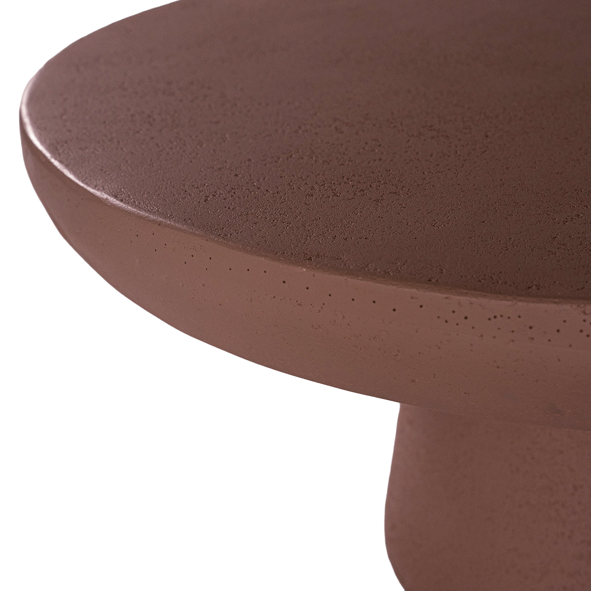 Tarran coffee table in cinnabar clay finish with rounded top and sculptural cylindrical leg
