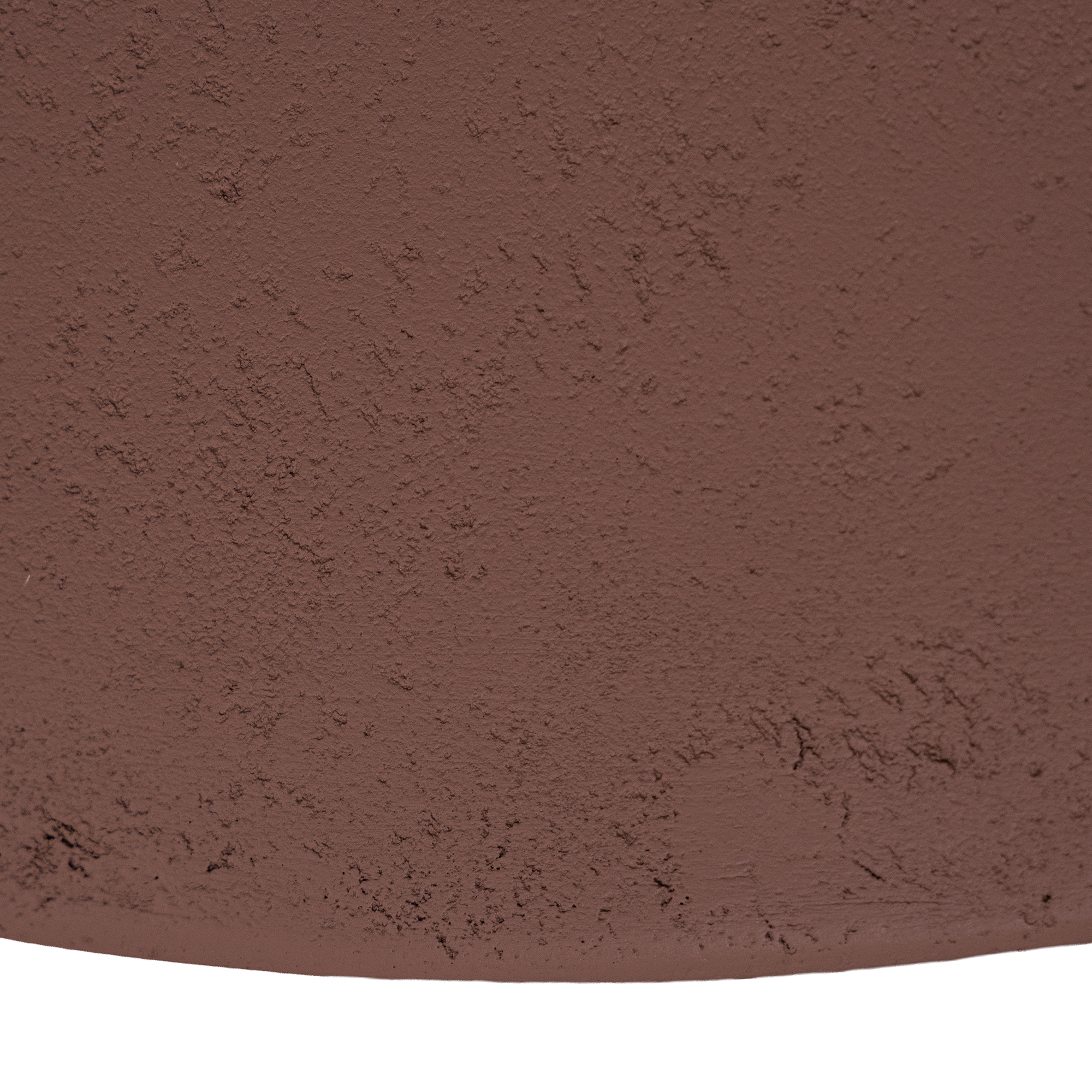 Tarran coffee table in cinnabar clay finish with rounded top and sculptural cylindrical leg