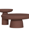 Tarran side table in cinnabar clay finish with rounded top and sculptural cylindrical leg.