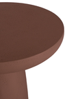 Tarran side table in cinnabar clay finish with rounded top and sculptural cylindrical leg.