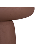 Tarran side table in cinnabar clay finish with rounded top and sculptural cylindrical leg.