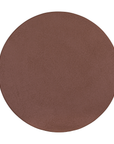 Tarran side table in cinnabar clay finish with rounded top and sculptural cylindrical leg.